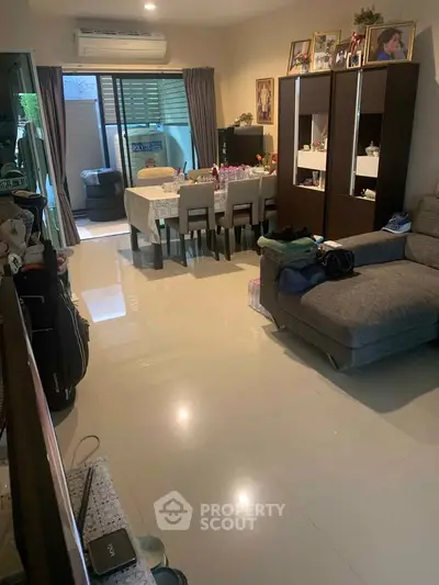 Spacious living room with modern furniture and large windows for natural light.