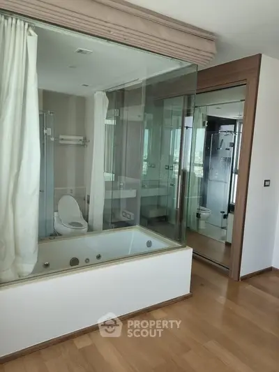 Luxurious bathroom with glass walls and modern fixtures