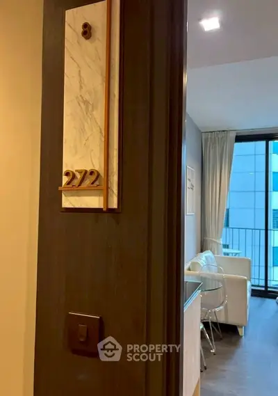 Modern apartment entrance with stylish interior and balcony view