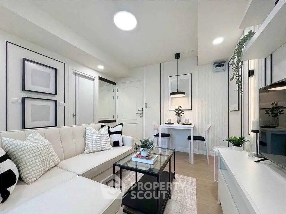 Modern living room with stylish decor and cozy seating area in a contemporary apartment.
