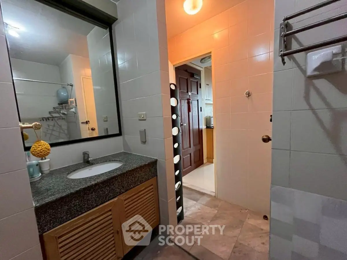 Spacious bathroom with modern fixtures and ample lighting