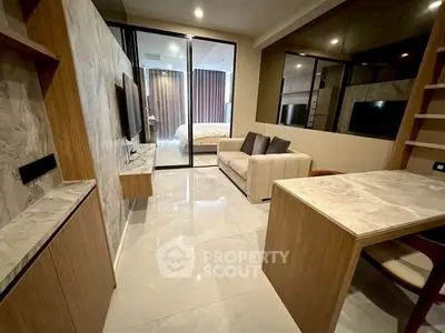 Modern living room with marble accents and cozy sofa in stylish apartment