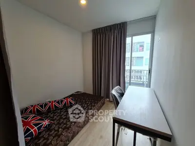 Cozy bedroom with modern decor and balcony view in urban apartment