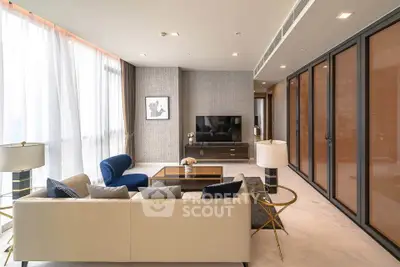 Luxurious modern living room with elegant furniture and large windows