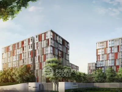 Modern apartment buildings with lush greenery and clear blue sky