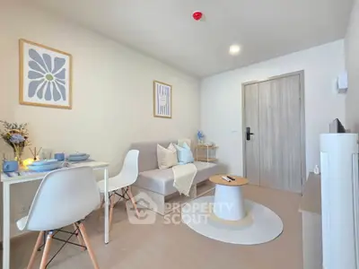Modern living room with stylish decor and cozy seating area in a contemporary apartment.