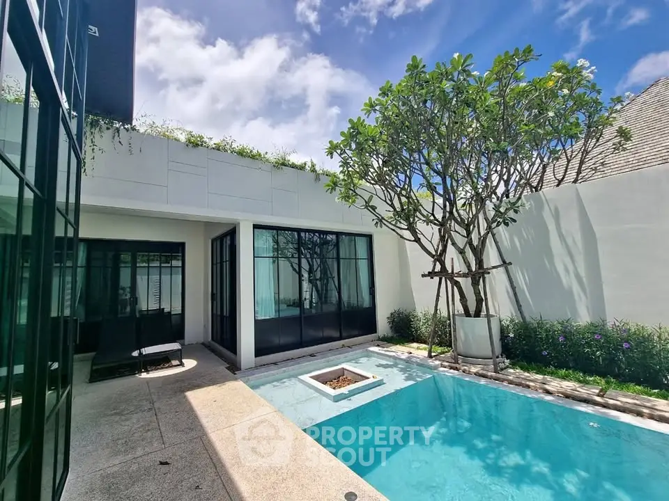 Luxurious modern villa with private pool and lush garden, perfect for serene living and relaxation.