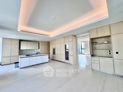 Spacious modern kitchen with sleek cabinetry and open layout in luxury apartment