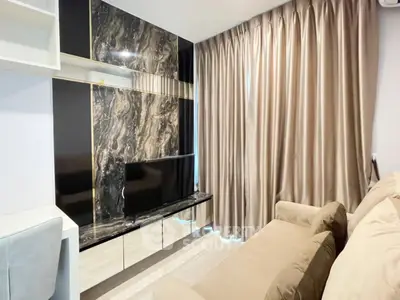 Modern living room with elegant marble TV wall and plush sofa