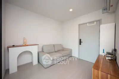 Modern minimalist living room with cozy sofa and sleek wooden furniture