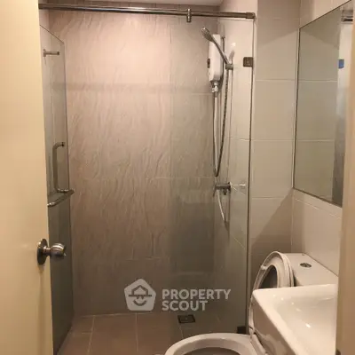 Modern bathroom with glass shower and sleek fixtures