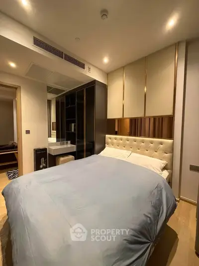 Luxurious bedroom with modern design and elegant furnishings in a high-end apartment.