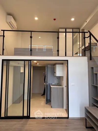Modern loft apartment with mezzanine and sleek kitchen design