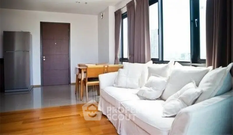 Spacious living room with modern decor and natural light