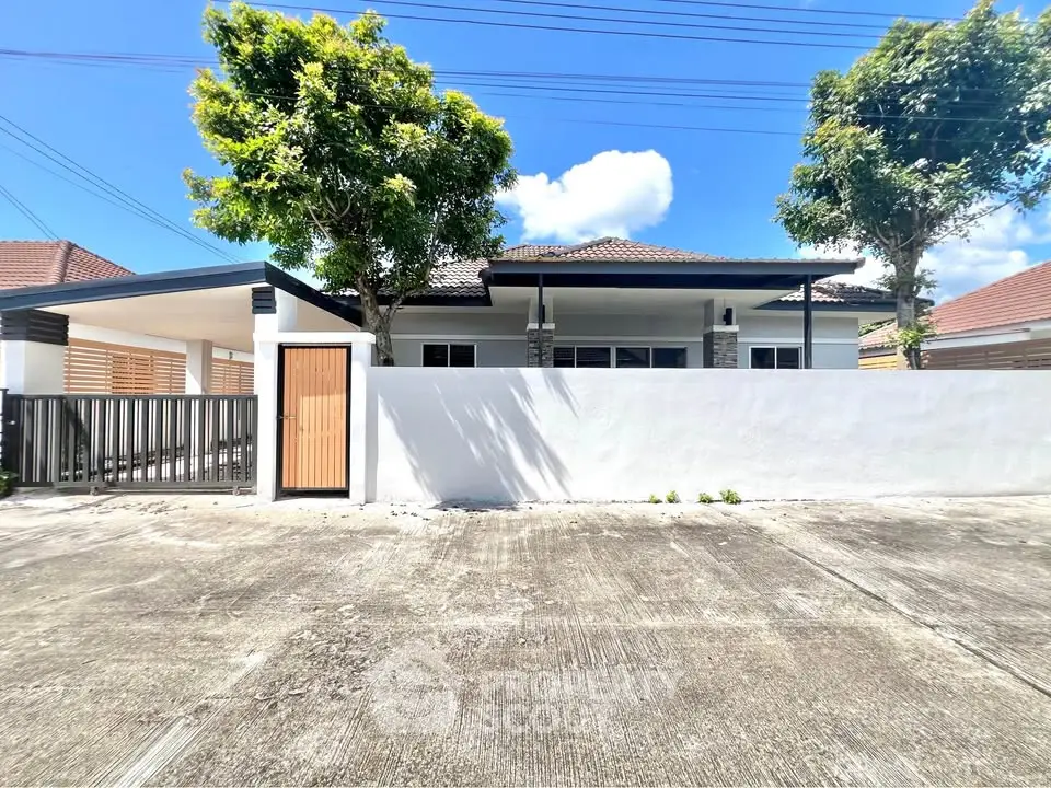 Charming single-story home with modern design and lush greenery, perfect for serene living.