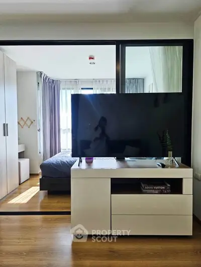 Modern studio apartment with sleek furniture and natural light