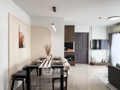 Modern open-plan living and dining area with stylish decor and natural light.