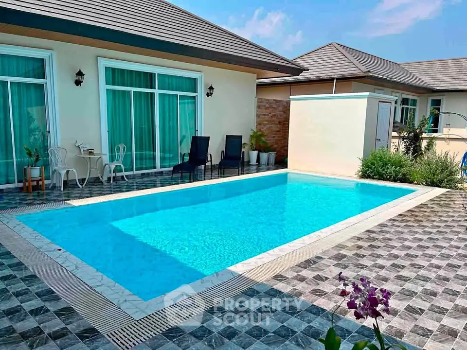 Luxurious private villa with a sparkling pool and elegant patio, perfect for relaxation and entertainment.