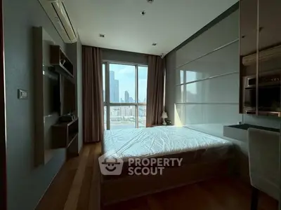 Modern bedroom with city view and sleek furnishings