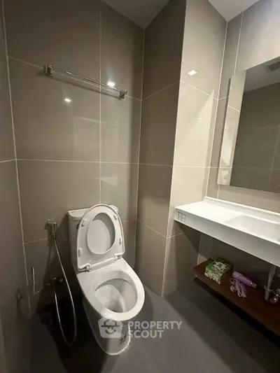 Modern bathroom with sleek design and large mirror