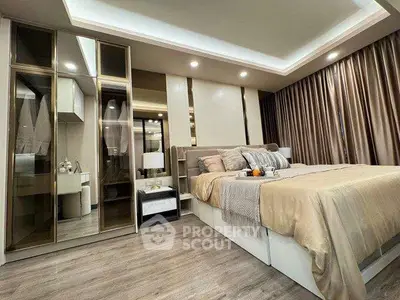Luxurious bedroom with elegant decor and modern furnishings, featuring a cozy bed and stylish lighting.