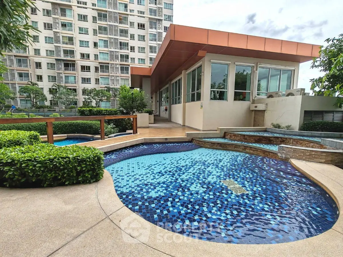 Luxurious condominium with stunning pool and lush garden view.