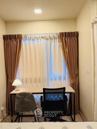 Cozy study nook with elegant curtains and modern desk setup