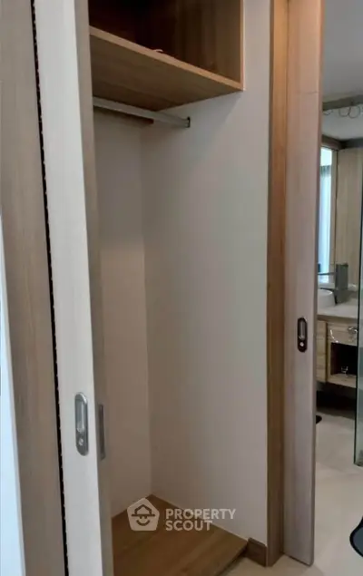 Spacious built-in closet with sliding doors in modern apartment