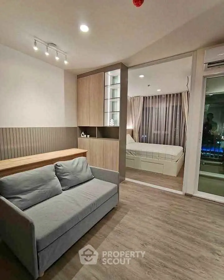 Modern studio apartment with cozy living area and bedroom