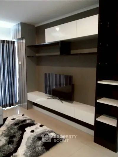 Modern living room with sleek TV unit and stylish decor