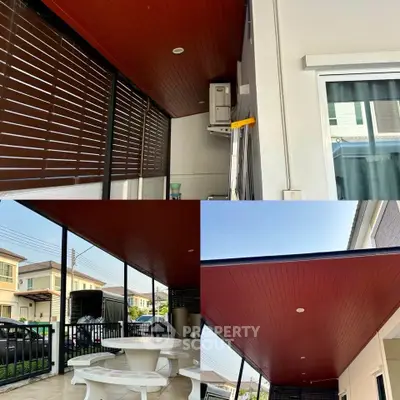 Stylish covered patio with modern design and outdoor seating area in a residential property.