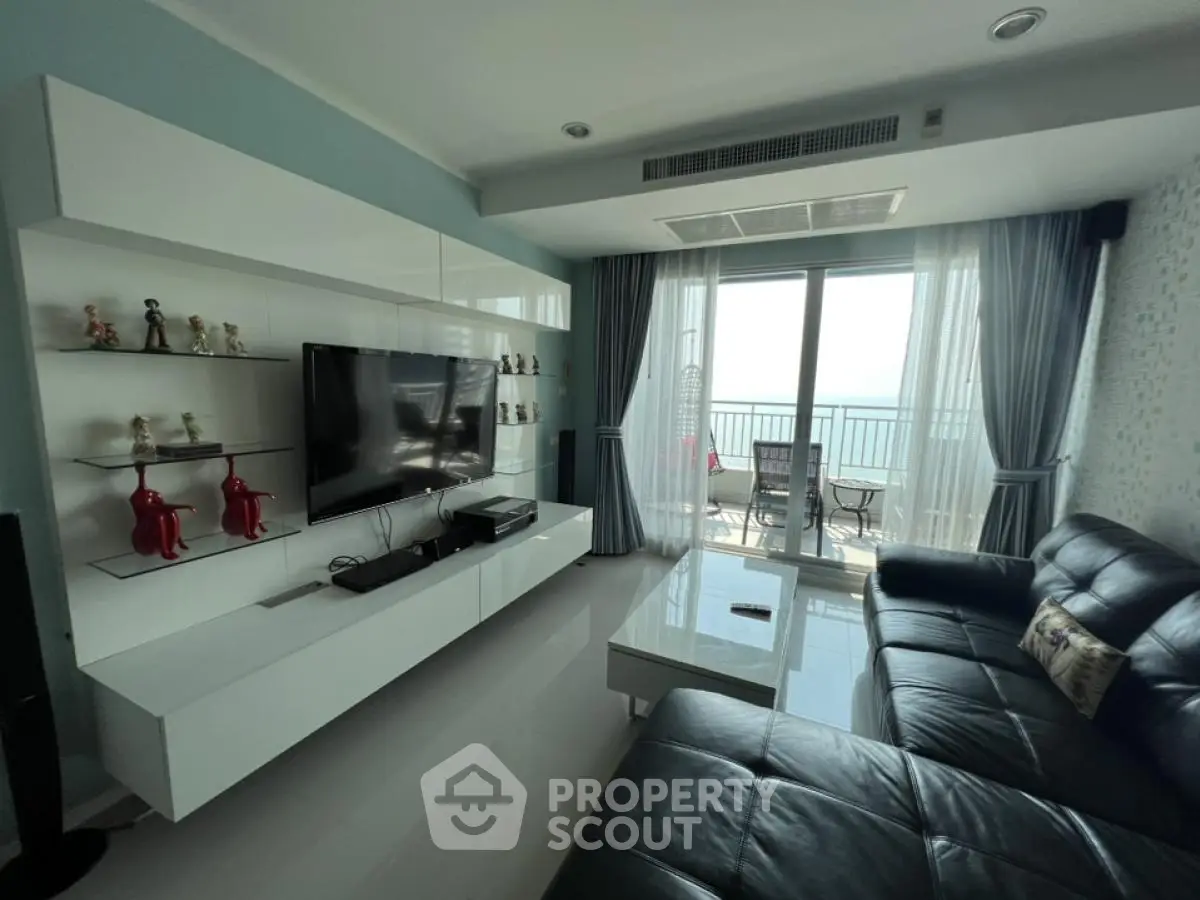Modern living room with sleek furniture and balcony view