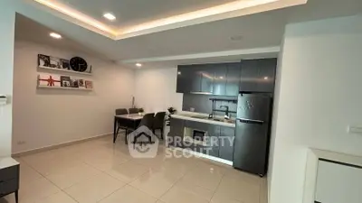 Modern kitchen with sleek cabinets and dining area in open layout