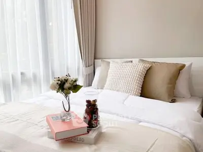 Cozy bedroom with elegant decor and natural light