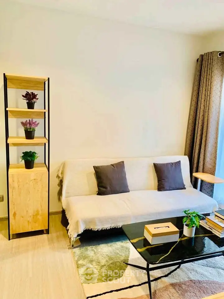 Modern living room with stylish sofa, chic coffee table, and elegant shelving unit.