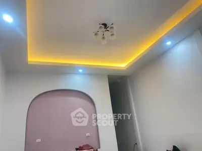 Modern interior with stylish ceiling lighting and unique wall design