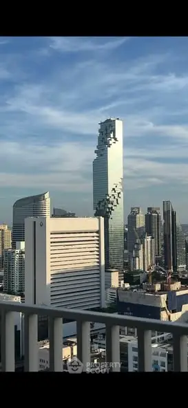 Stunning cityscape view featuring iconic skyscraper with unique architecture in vibrant urban setting.
