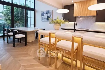 Luxurious modern kitchen with elegant wooden accents and open layout