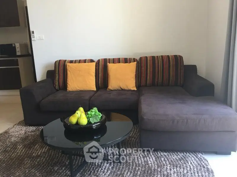 Stylish living room with modern sofa and chic decor in a cozy apartment.