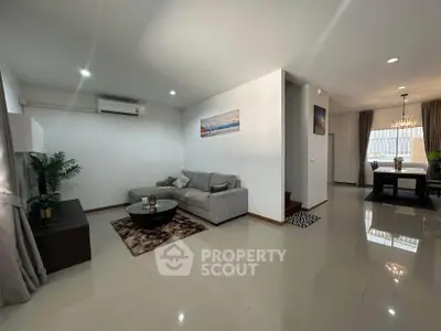 Spacious modern living room with elegant dining area and stylish decor