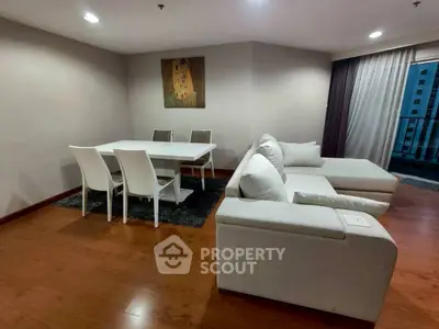 Spacious modern living room with elegant dining area and cozy seating, perfect for relaxation.