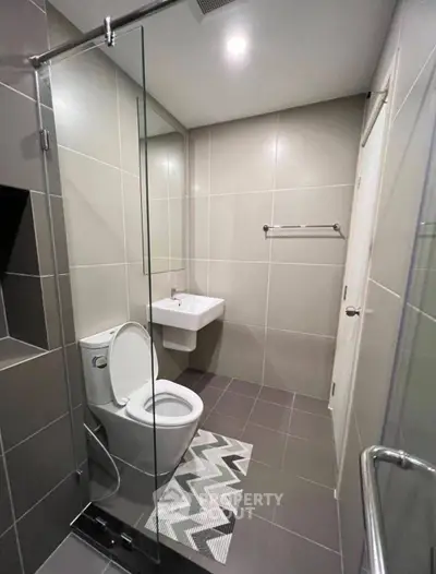 Modern bathroom with sleek design and glass shower enclosure