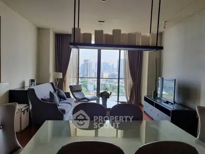 Spacious living room with city view, modern furniture, and elegant decor.