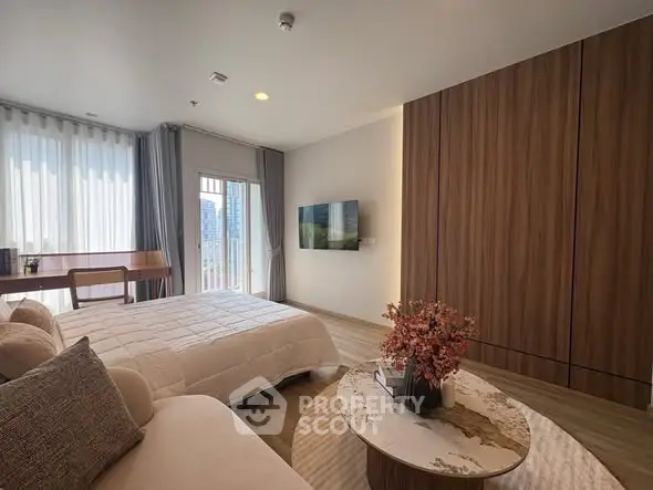 Spacious modern bedroom with elegant decor and natural light