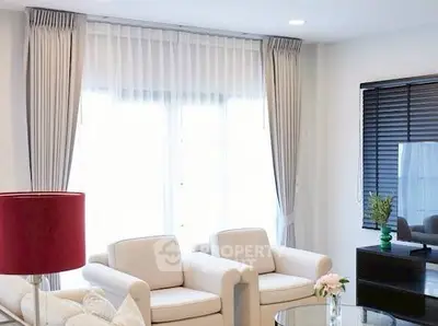 Elegant living room with cozy armchairs and modern decor