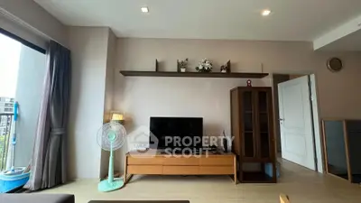Modern living room with sleek TV unit and stylish decor in a contemporary apartment.