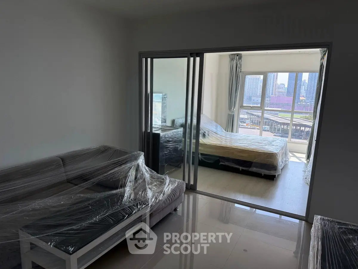 Modern apartment with sliding glass doors and city view balcony