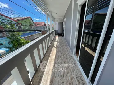 Spacious balcony with tiled flooring and scenic neighborhood view