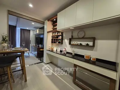 Modern open-layout kitchen with sleek cabinetry and dining area