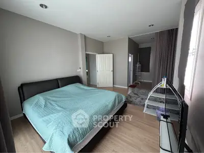 Spacious modern bedroom with elegant decor and natural light